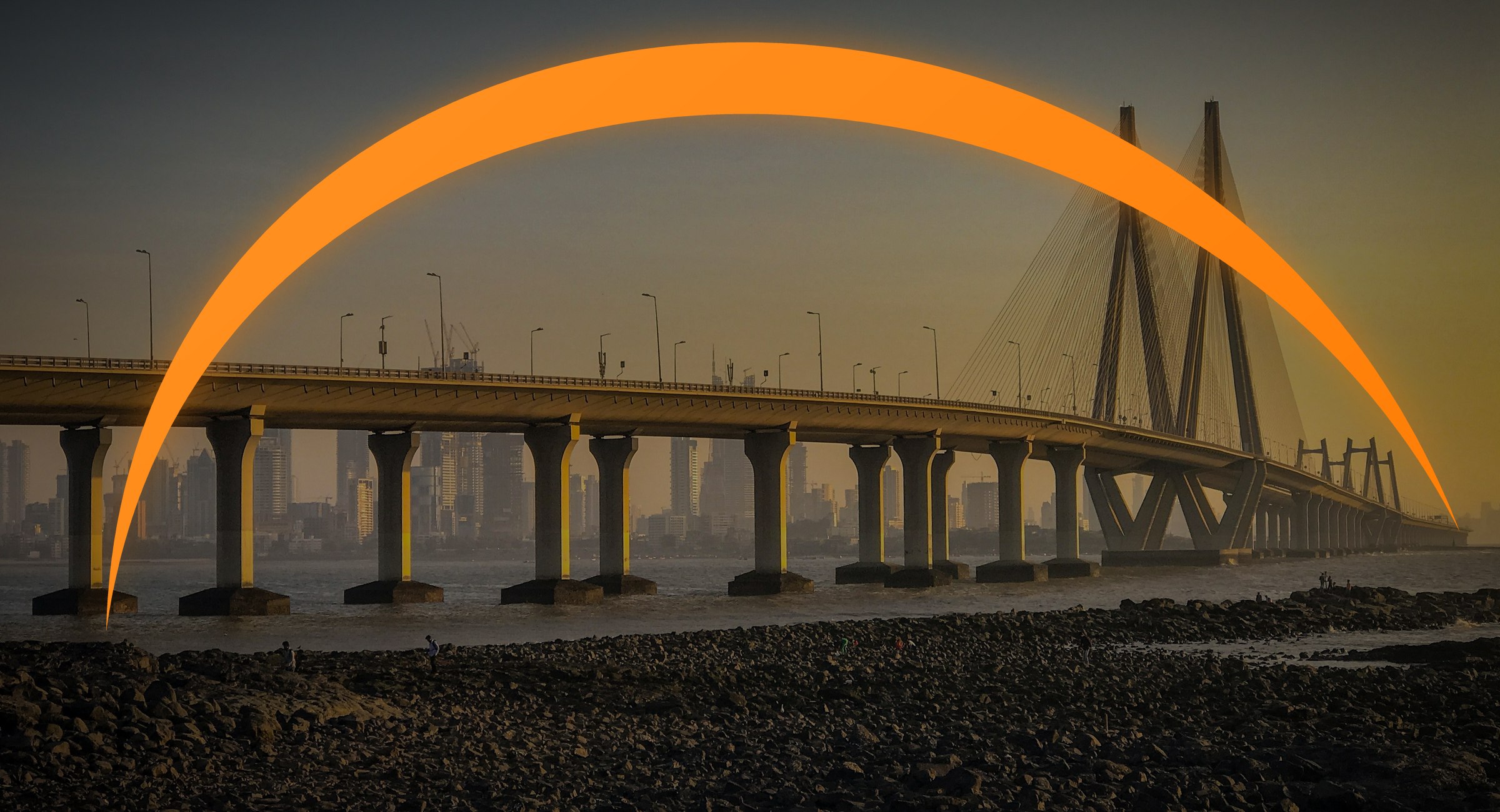 Bandra-Worli Sea Link in Mumbai at sunset with the Gen India orange swoosh